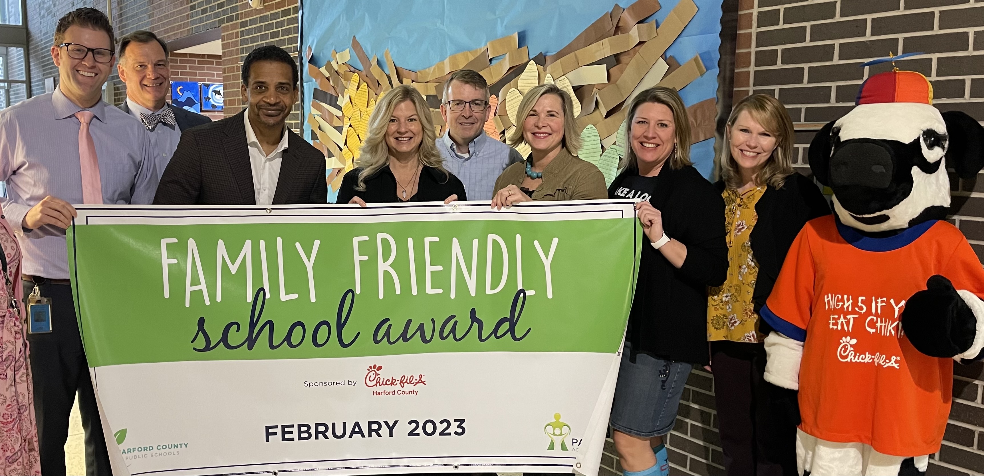 Emmorton Elementary School and HCPS Administrators Hold Up February Family Friendly School Banner